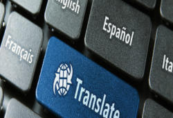 Multilingual translation online concept. Close up of multi language keyboard and translate word key in blue color with clipping path.
