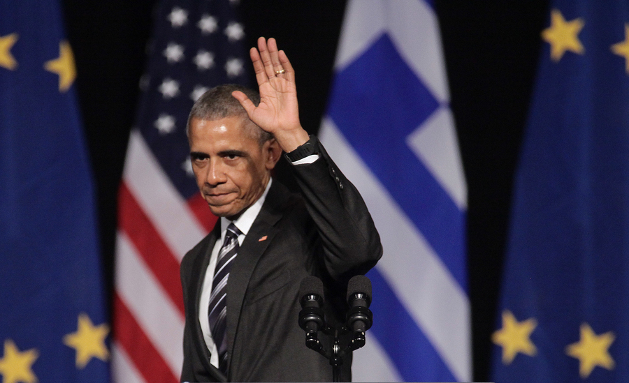 President Barack Obama Waves To The Crowd As He Delivers A Speec
