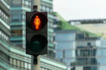 Red Woman Pedestrian Signal. Many Traffic Lights With Female Fig