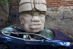 Giant olmec Stone Head Crashes from Sky! Watch a Tesla Get Destroyed [VIDEO]